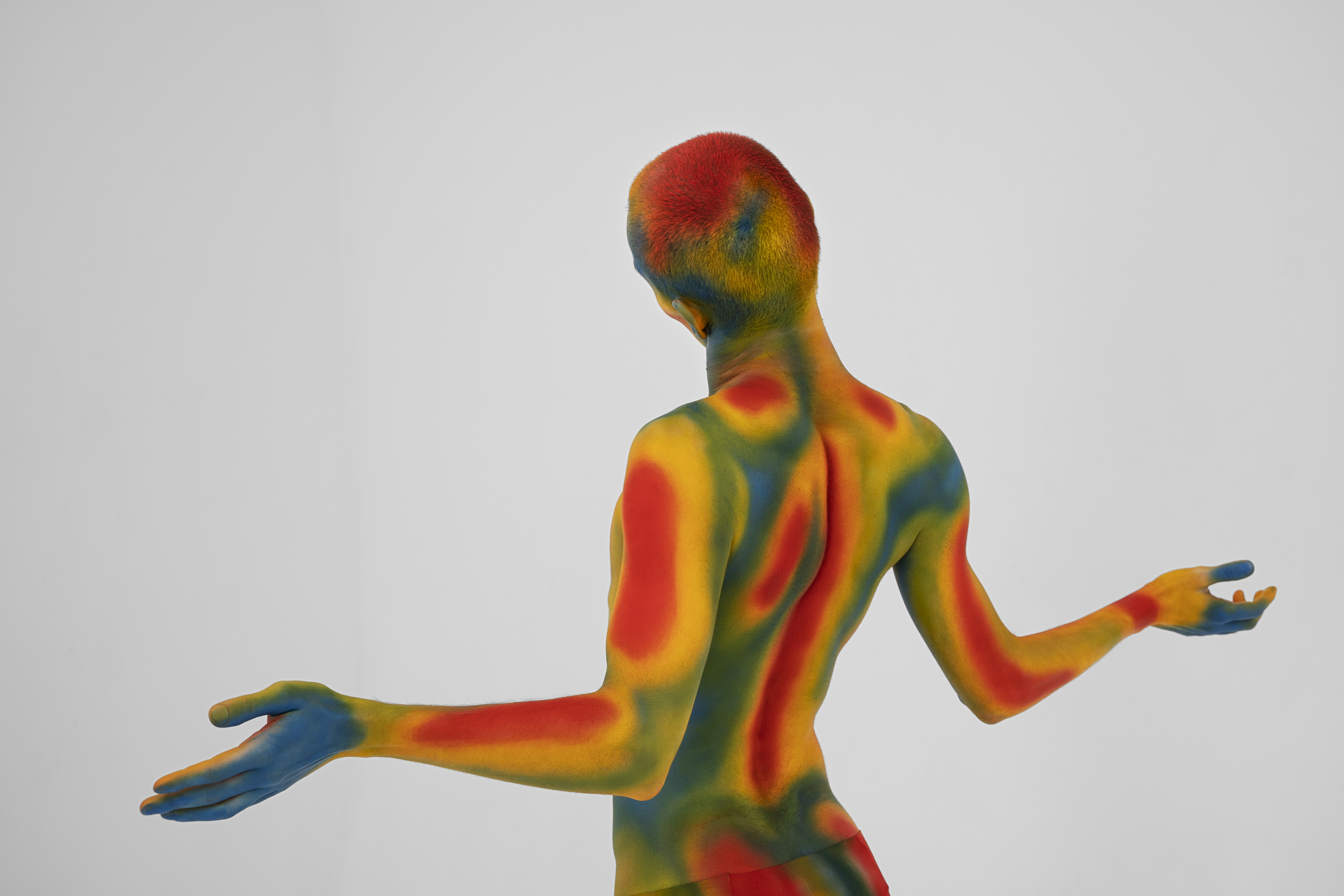 Multicolored figure posing